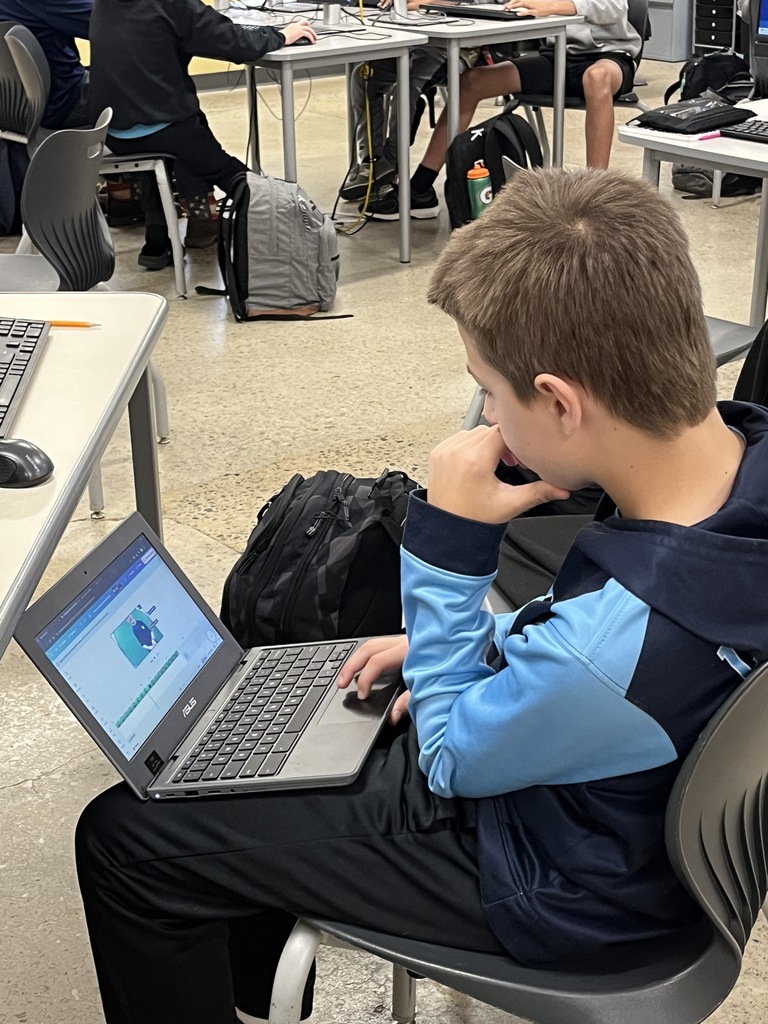 A student edits videos  as part of a weather forecast production unit. 