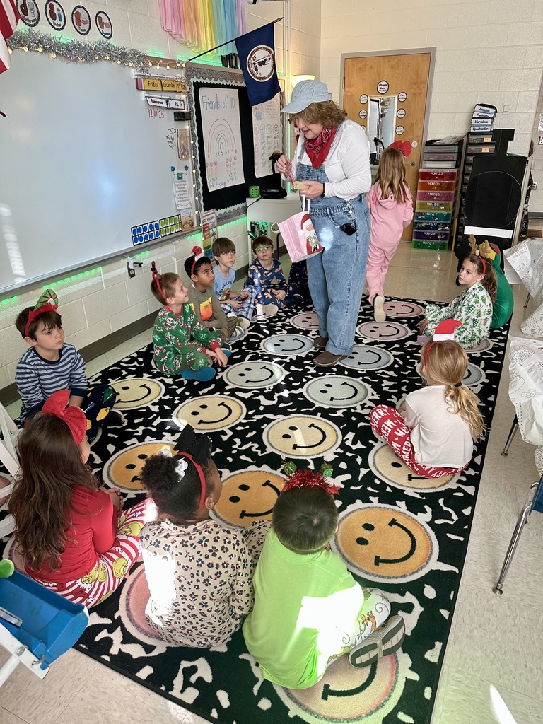 A conductor speaks to a group of children on Polar Express Day.