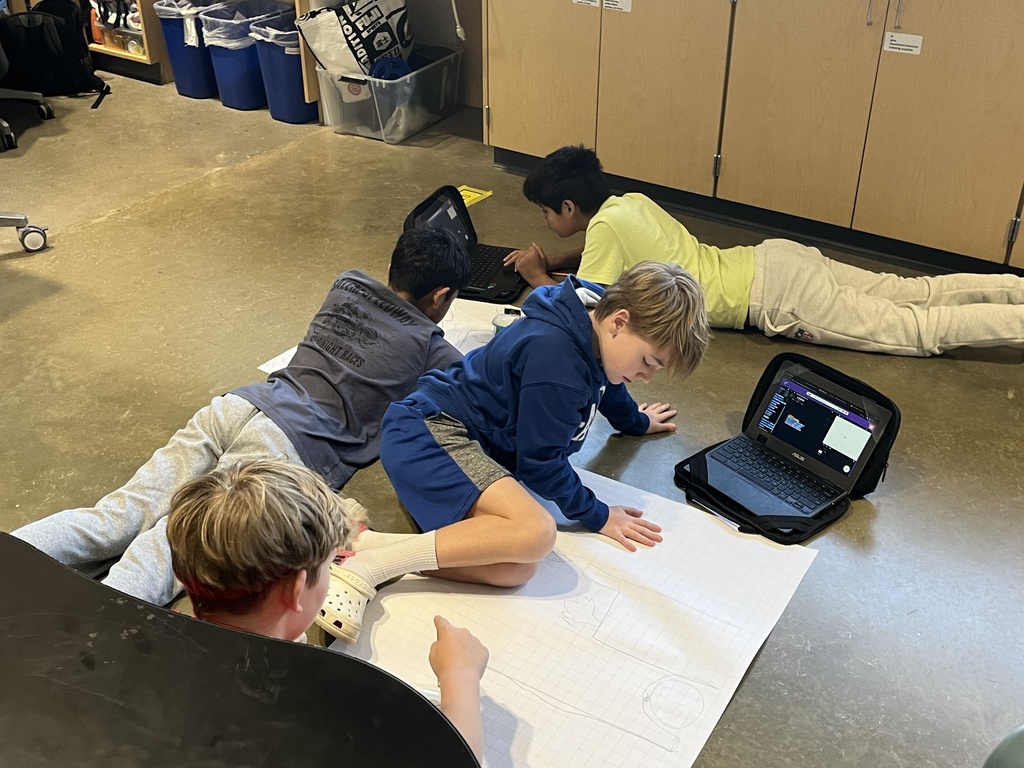 Students work on a mars rover related assignment in science class. 