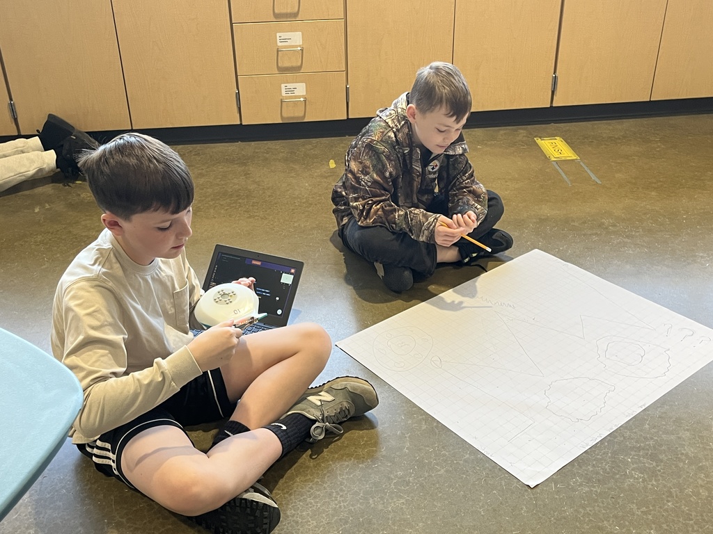 Students work on a mars rover related assignment in science class. 