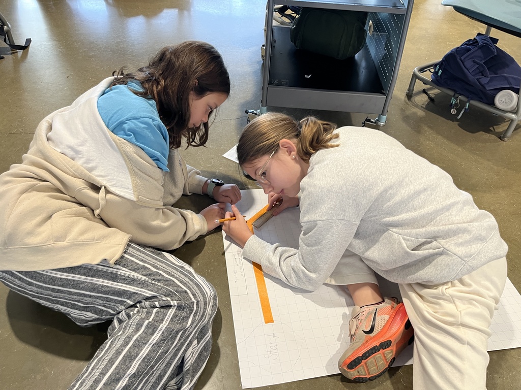 Students work on a mars rover related assignment in science class. 