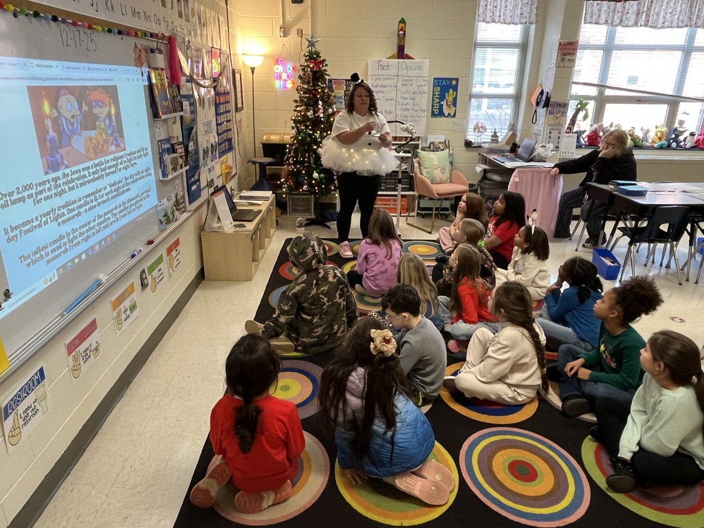 A teacher explains a holidays around the world activity.