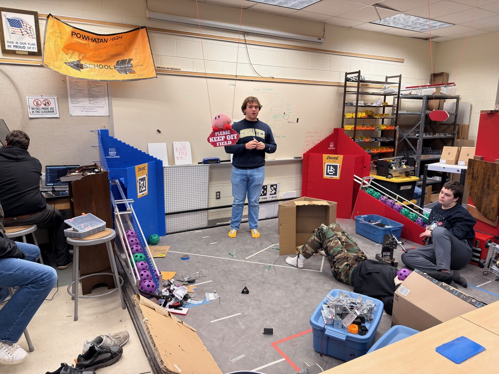 Robotics team members work on a robotics course.