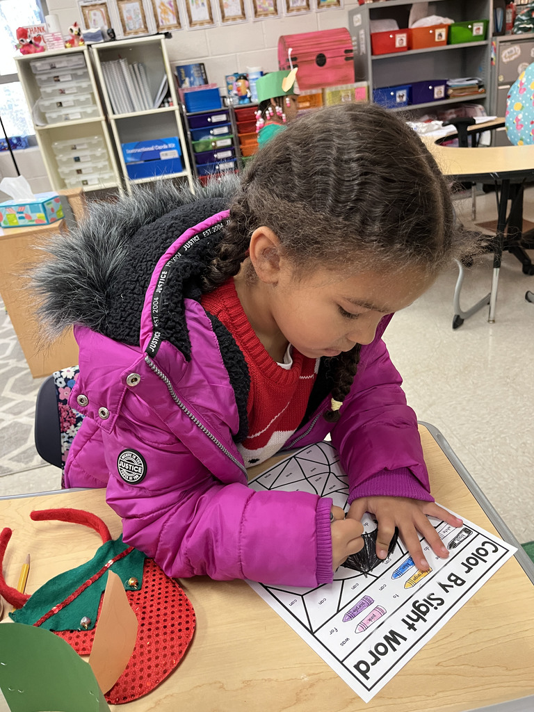 A student works on a coloring sheet.