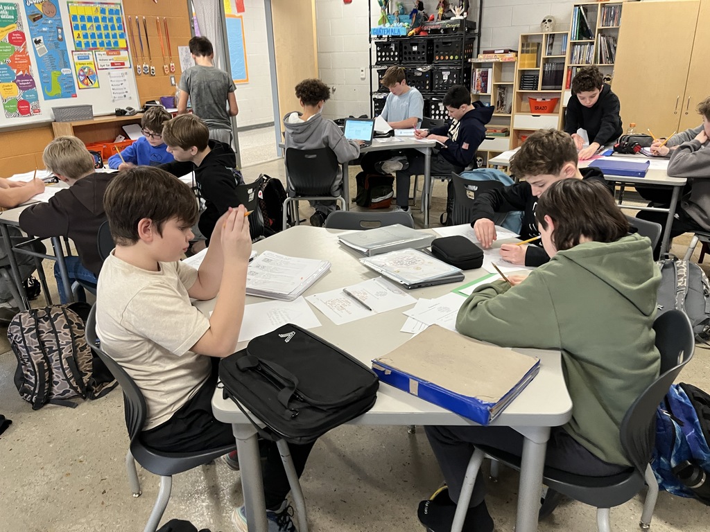 Students in Spanish class write poems about themselves in Spanish.