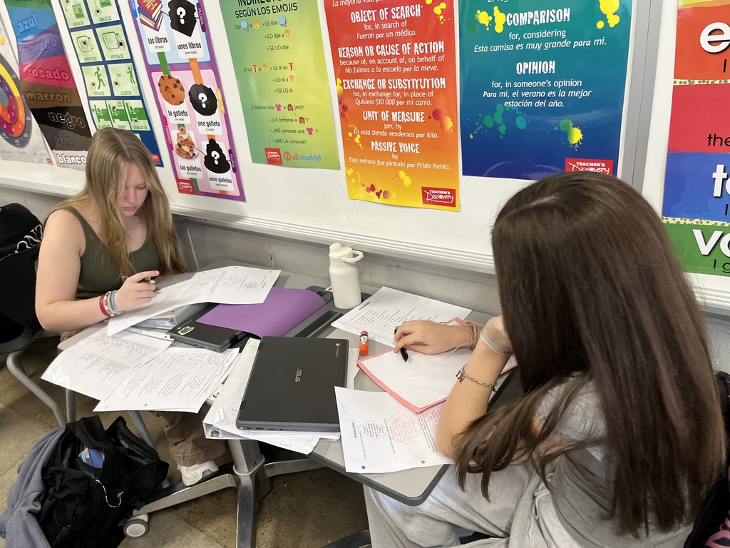 Students in Spanish class write poems about themselves in Spanish.