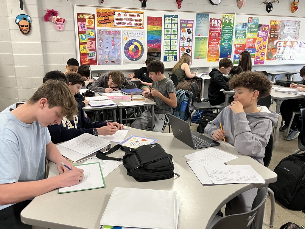 Students in Spanish class write poems about themselves in Spanish.