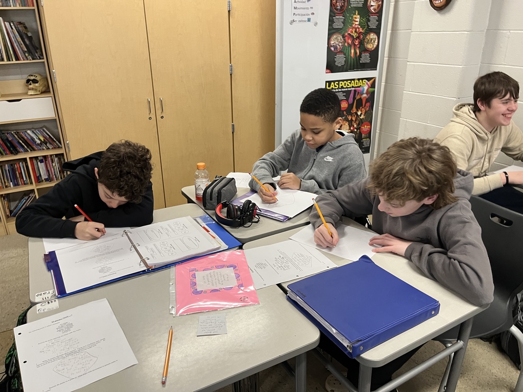 Students in Spanish class write poems about themselves in Spanish.