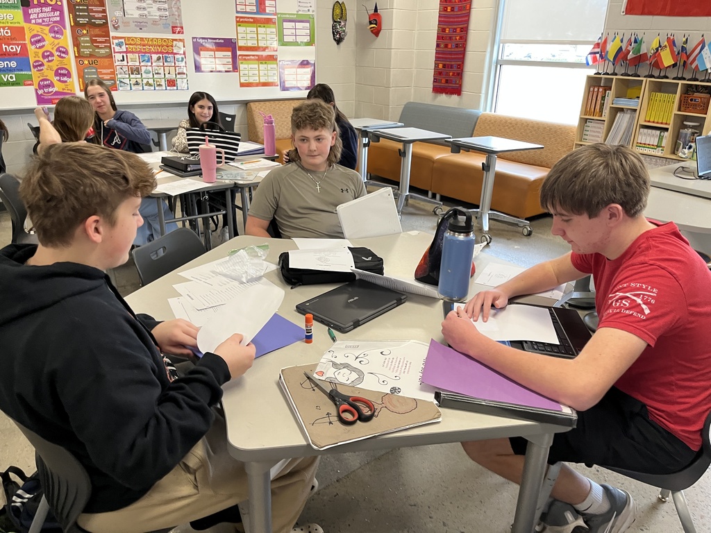 Students in Spanish class write poems about themselves in Spanish.