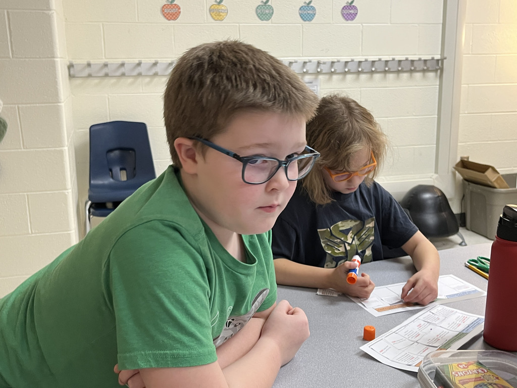 Children work on a sorting activity about resources in Ancient China.