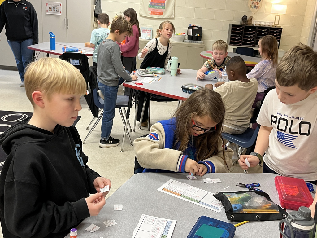 Children work on a sorting activity about resources in Ancient China.