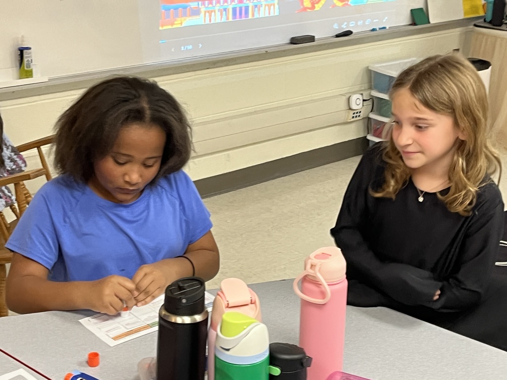 Children work on a sorting activity about resources in Ancient China.