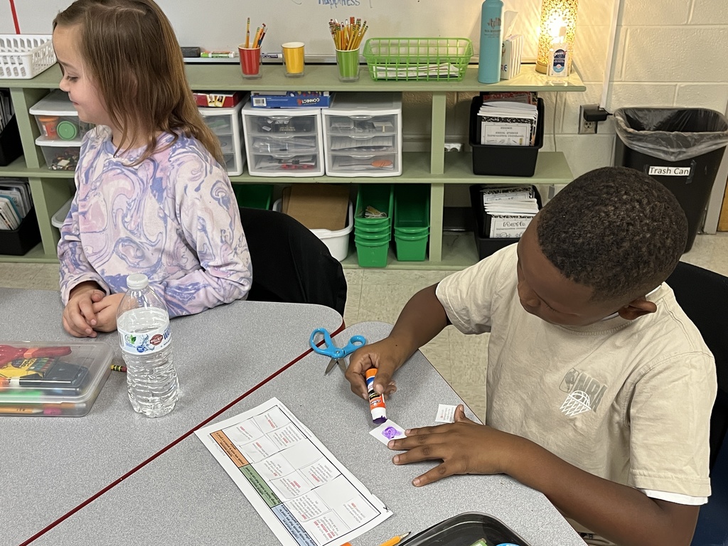 Children work on a sorting activity about resources in Ancient China.