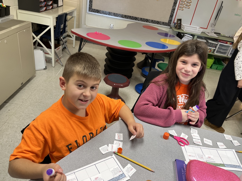 Children work on a sorting activity about resources in Ancient China.