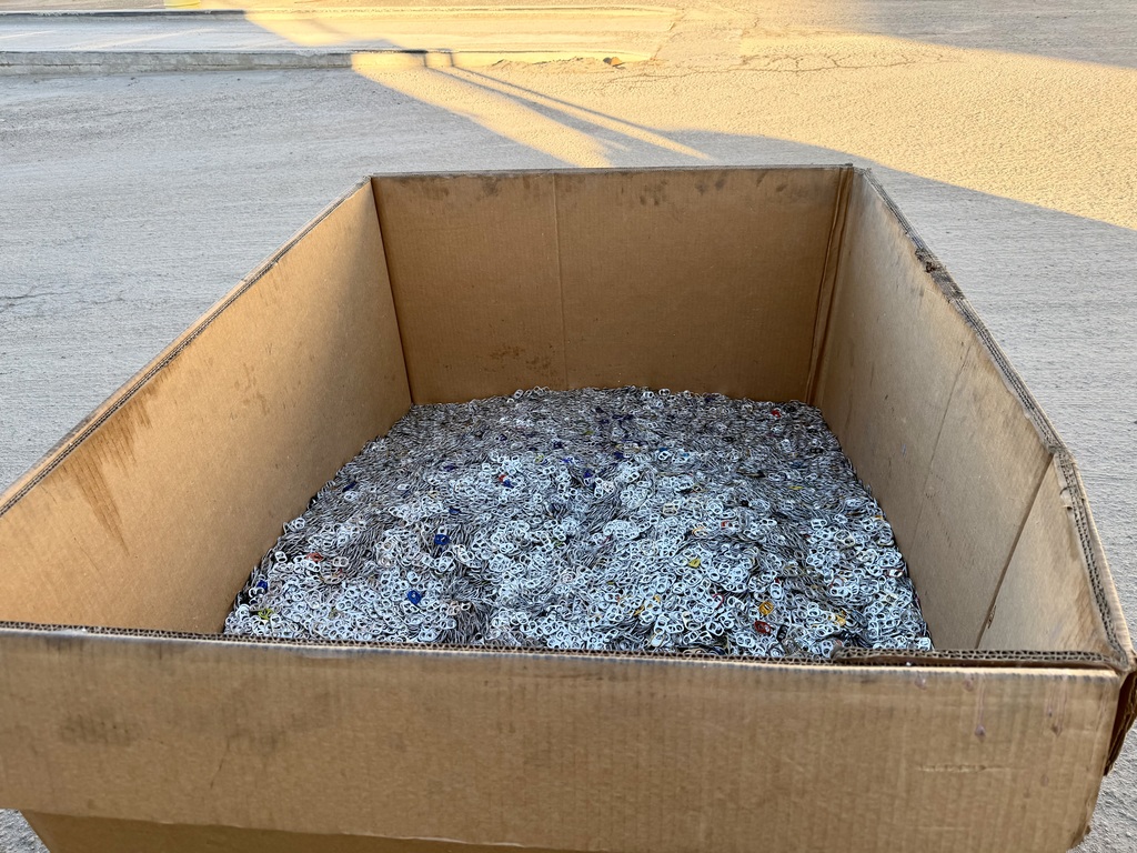 Box full of pop tabs.