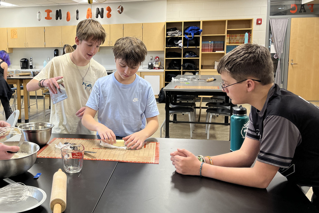 Students in a family and consumer sciences class work together to make pie dough from scratch.