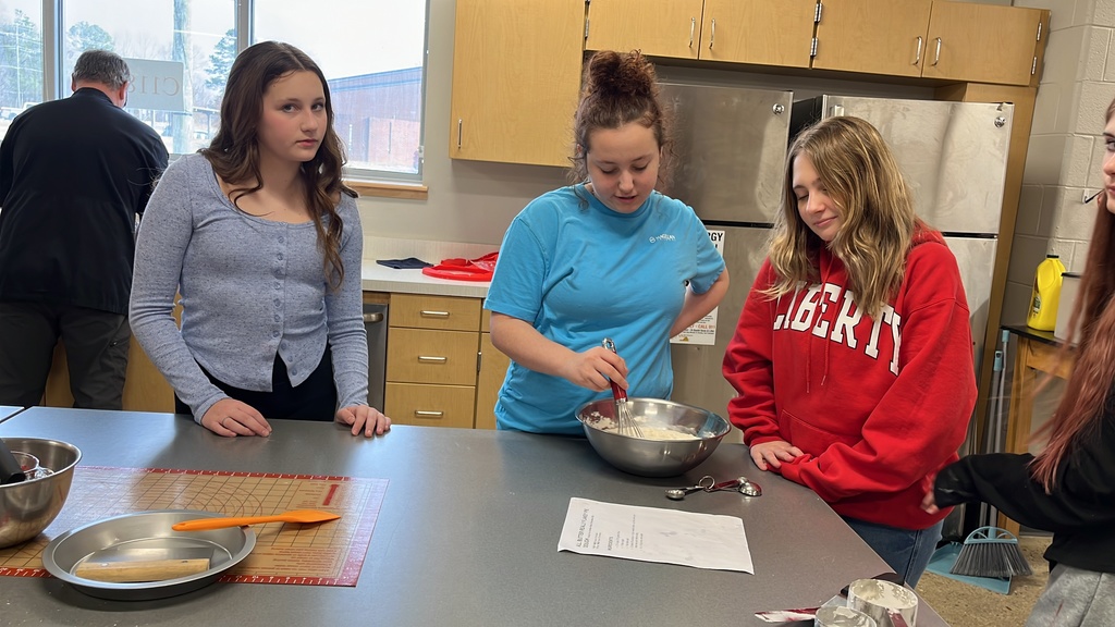 Students in a family and consumer sciences class work together to make pie dough from scratch.
