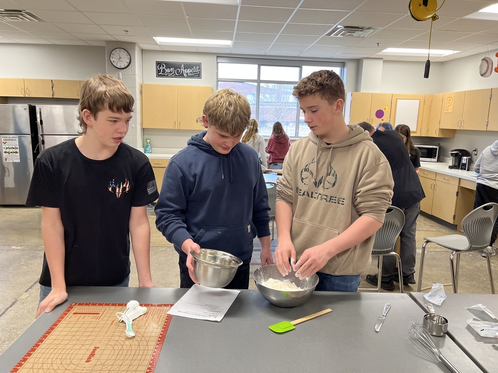Students in a family and consumer sciences class work together to make pie dough from scratch.