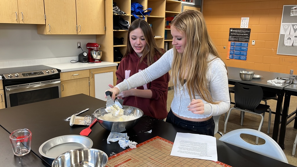 Students in a family and consumer sciences class work together to make pie dough from scratch.