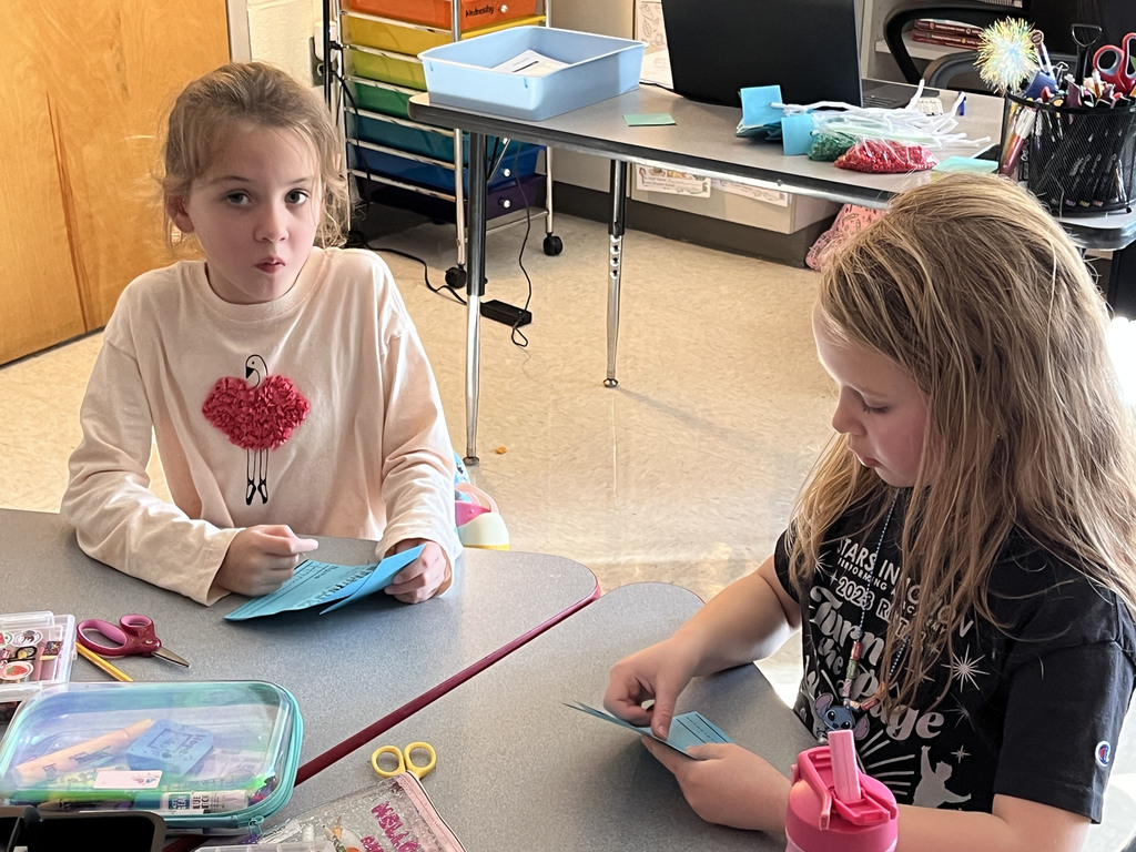 First graders work on a sun tracker in class. 