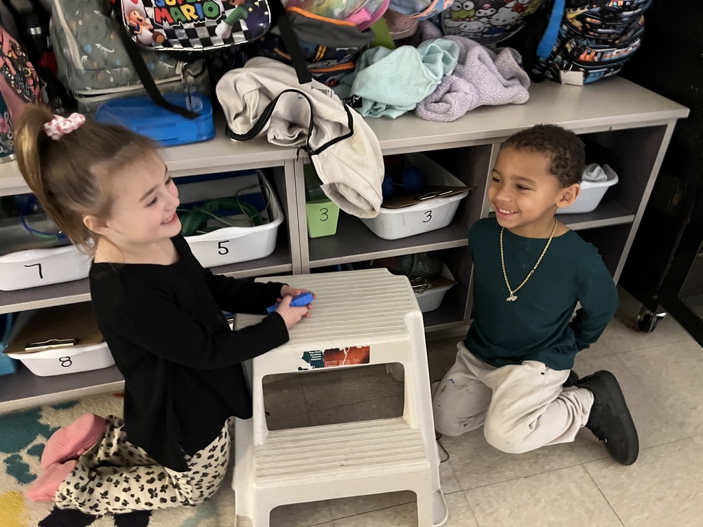 Students use math manipulatives  to learn about the parts of five.