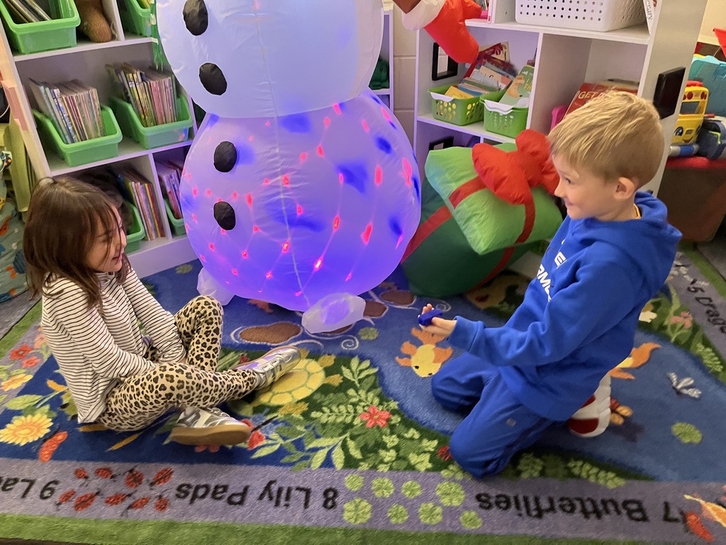 Students use math manipulatives  to learn about the parts of five.