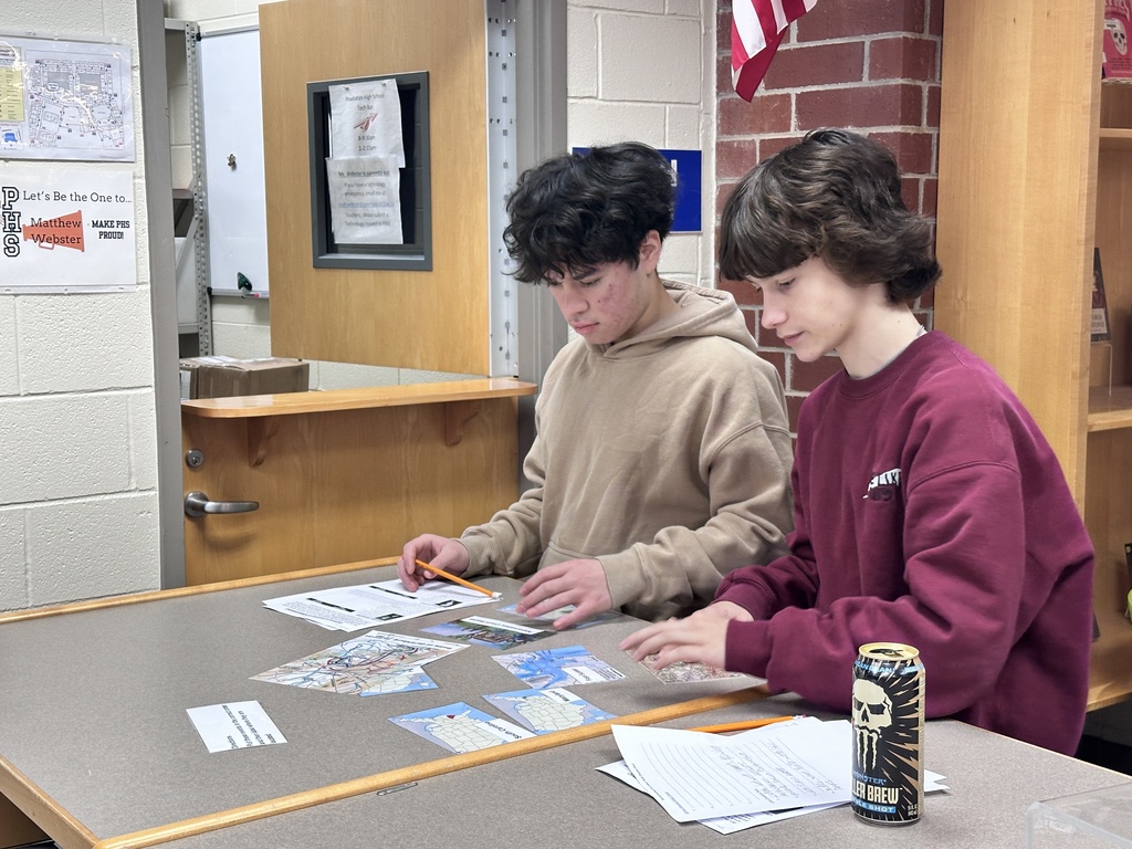 Students participate in a Civil War scavenger hunt in the school library.