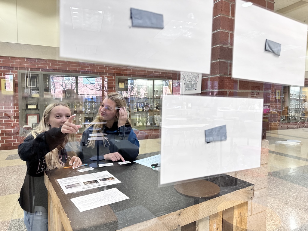 Students participate in a Civil War scavenger hunt in the school library.