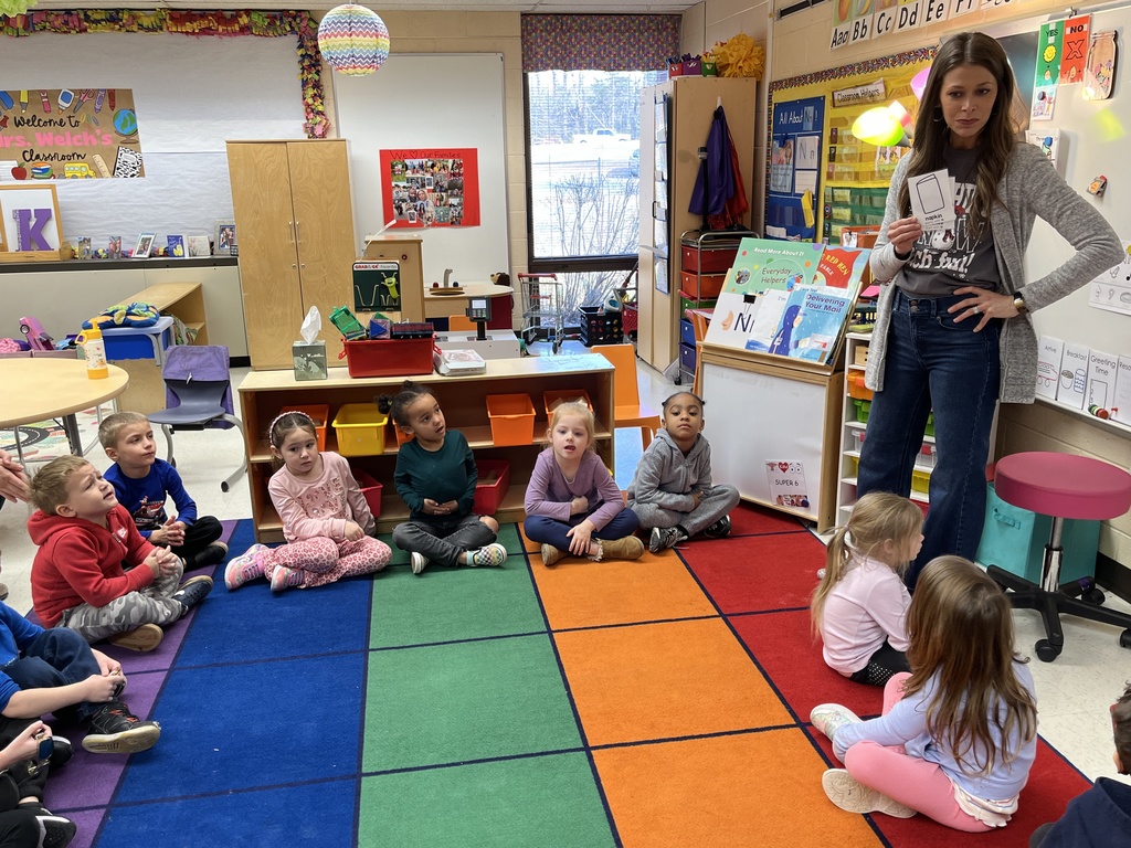 Students in a preschool class do an activity around the letter N with their teacher.