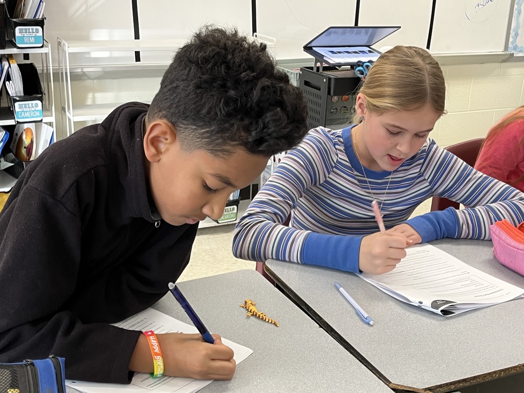 Students work on a lesson focused on strengthening grammar skills by working on consistent verb tenses. 