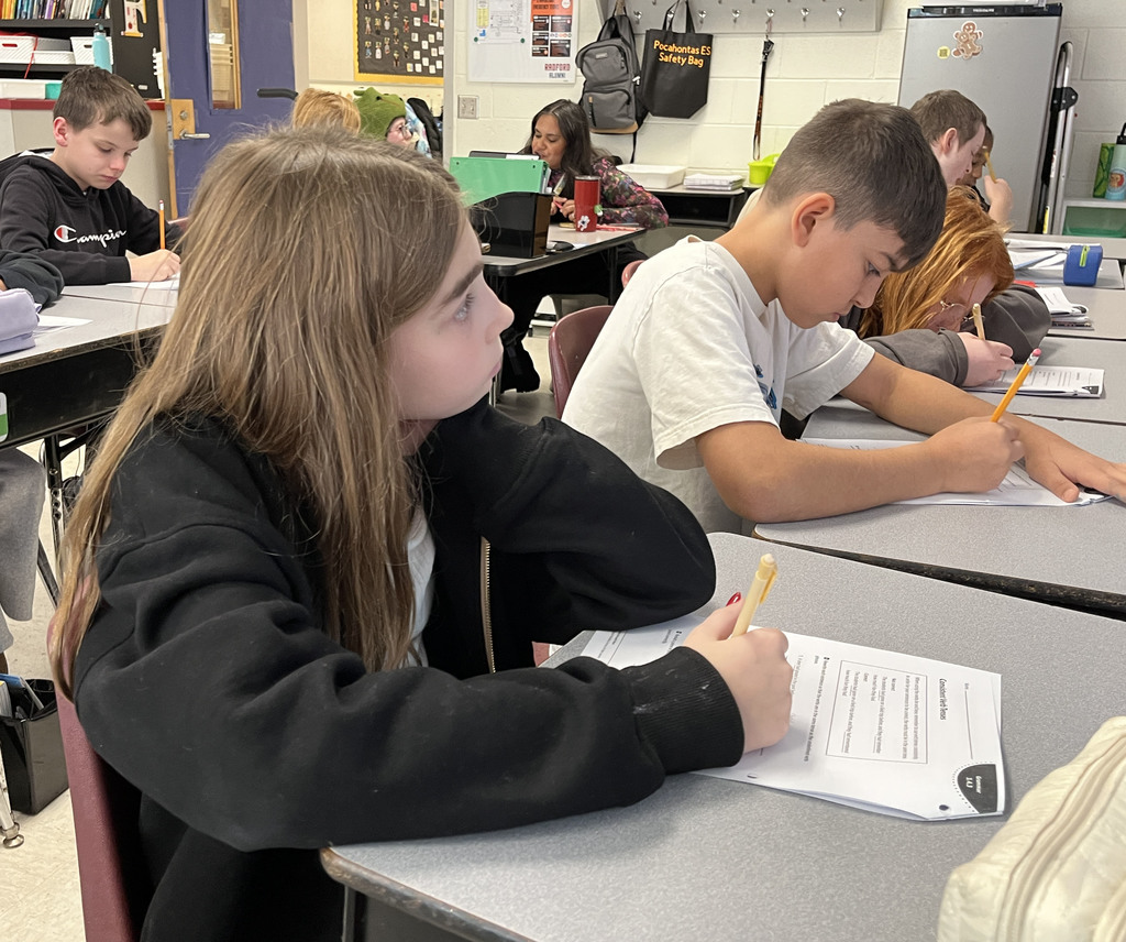 Students work on a lesson focused on strengthening grammar skills by working on consistent verb tenses. 