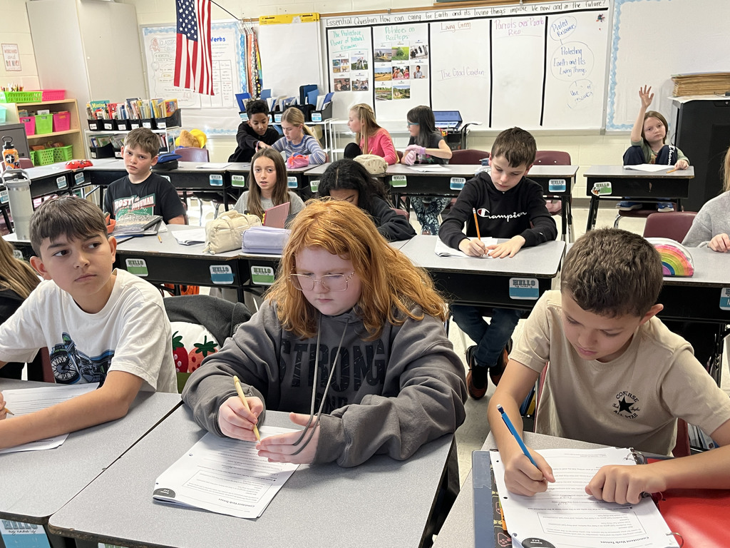 Students work on a lesson focused on strengthening grammar skills by working on consistent verb tenses. 