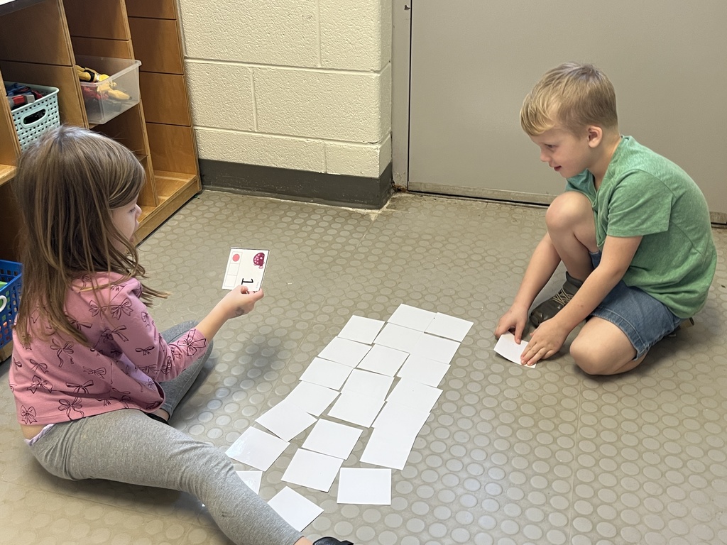 Students use cards to practice addition skills by making combinations to get to the number 3. 