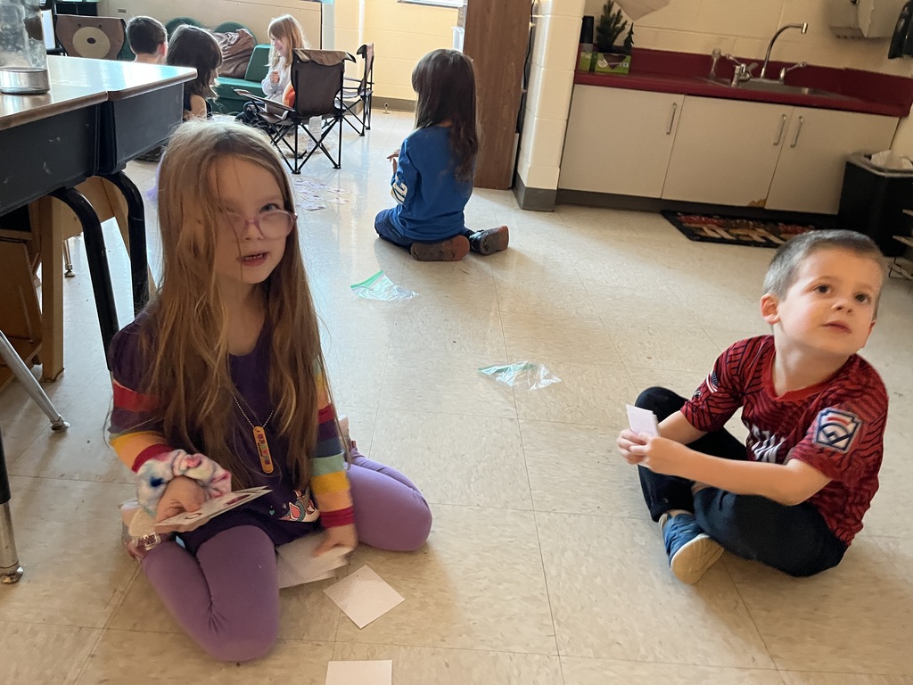 Students use cards to practice addition skills by making combinations to get to the number 3. 