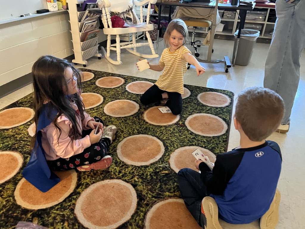 Students use cards to practice addition skills by making combinations to get to the number 3. 