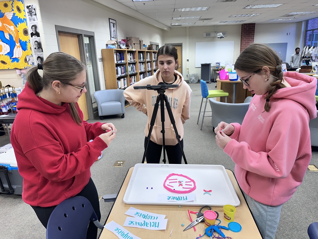 Students work on a stop motion video about cell division. 