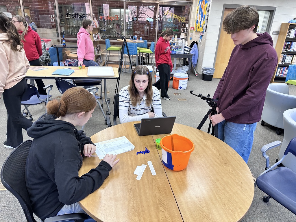 Students work on a stop motion video about cell division. 