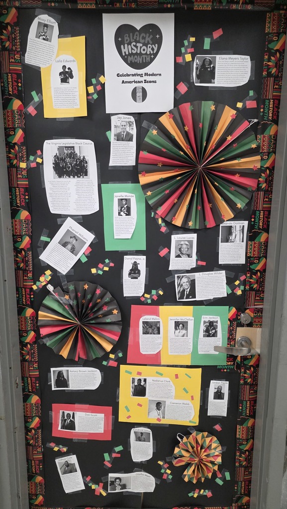 Phoot of a door that has been decorated for Black History Month featuring short biographies of modern icons.
