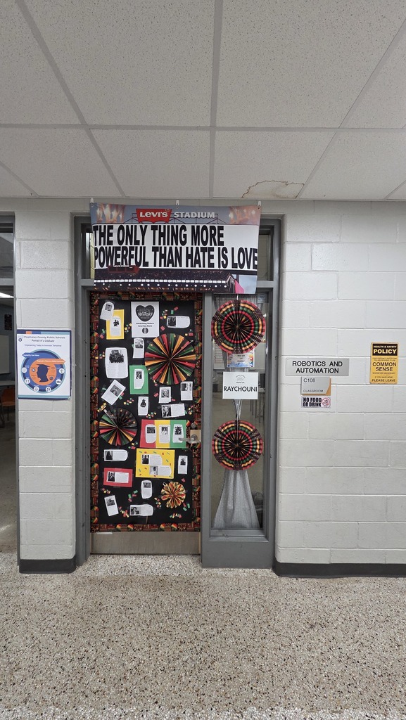 Phoot of a door that has been decorated for Black History Month featuring short biographies of modern icons.