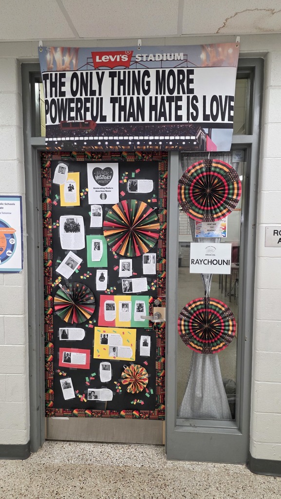Phoot of a door that has been decorated for Black History Month featuring short biographies of modern icons.