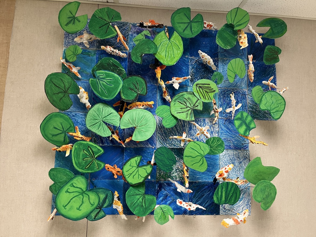 Photo of a koi pond art installation created by elementary students in art class.