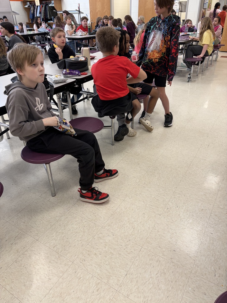Elementary students watch the Olympics at lunch.