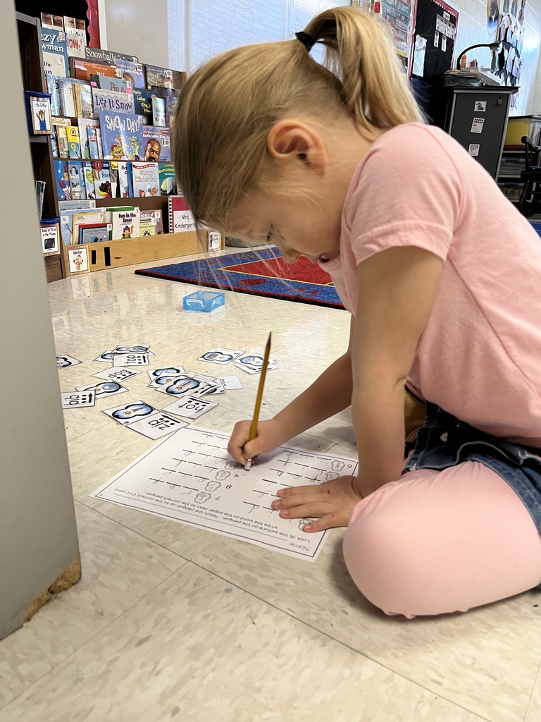 A child works at a literacy station in class. 