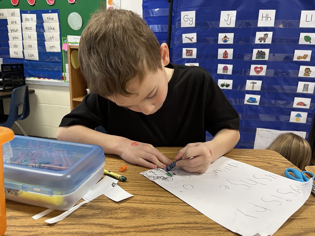 A child works at a literacy station in class. 