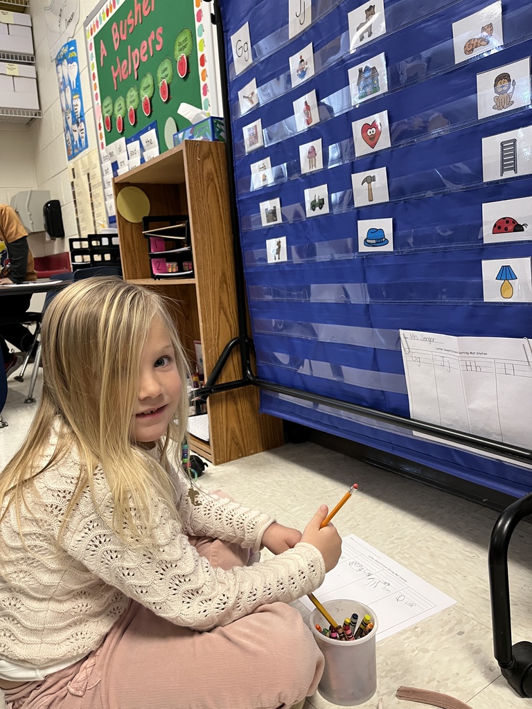 A child works at a literacy station in class. 