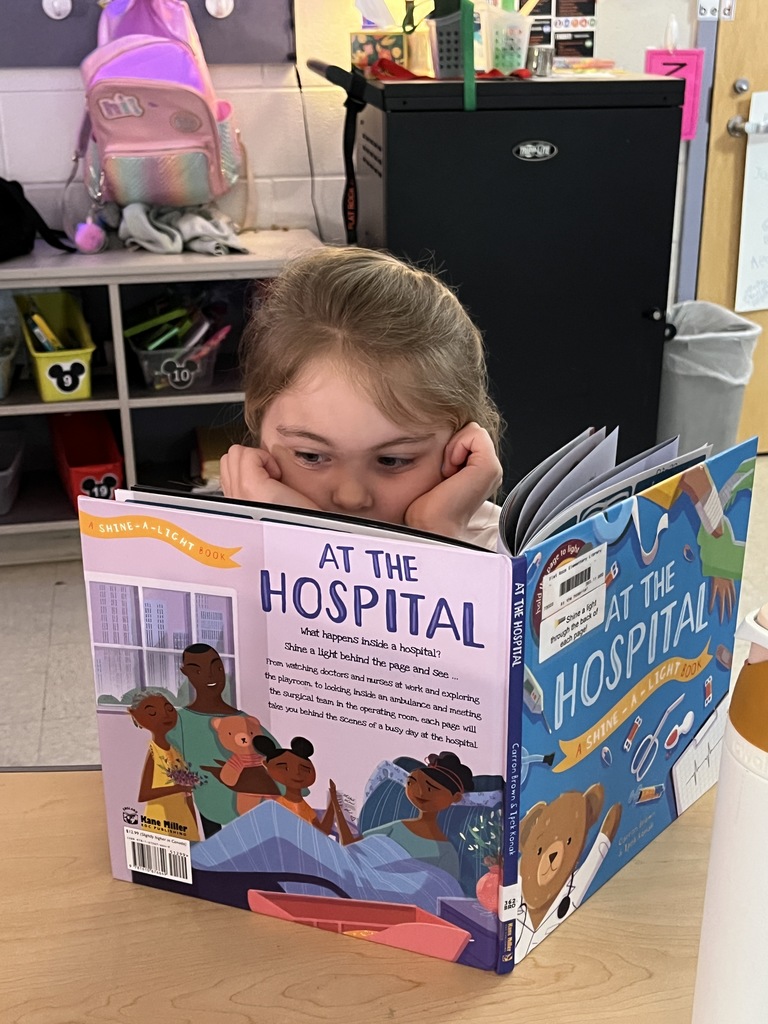 A child reads during the drop everything and read morning routine.