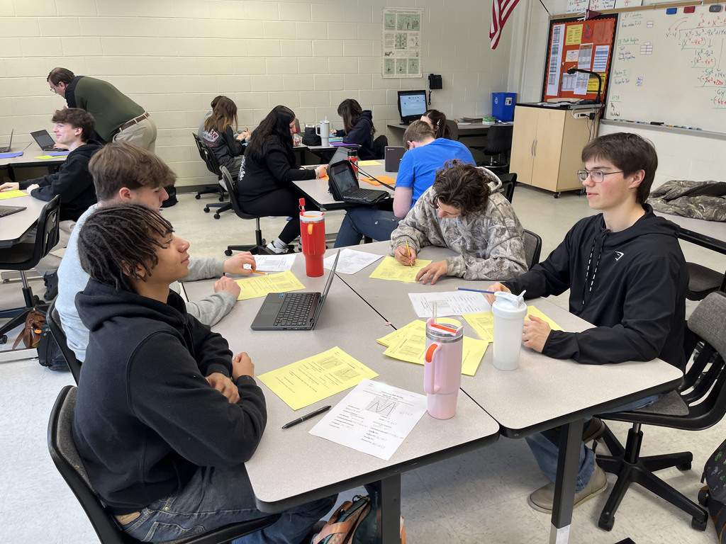 Algebra II classes work in groups to review polynomial operations and division through rotating stations