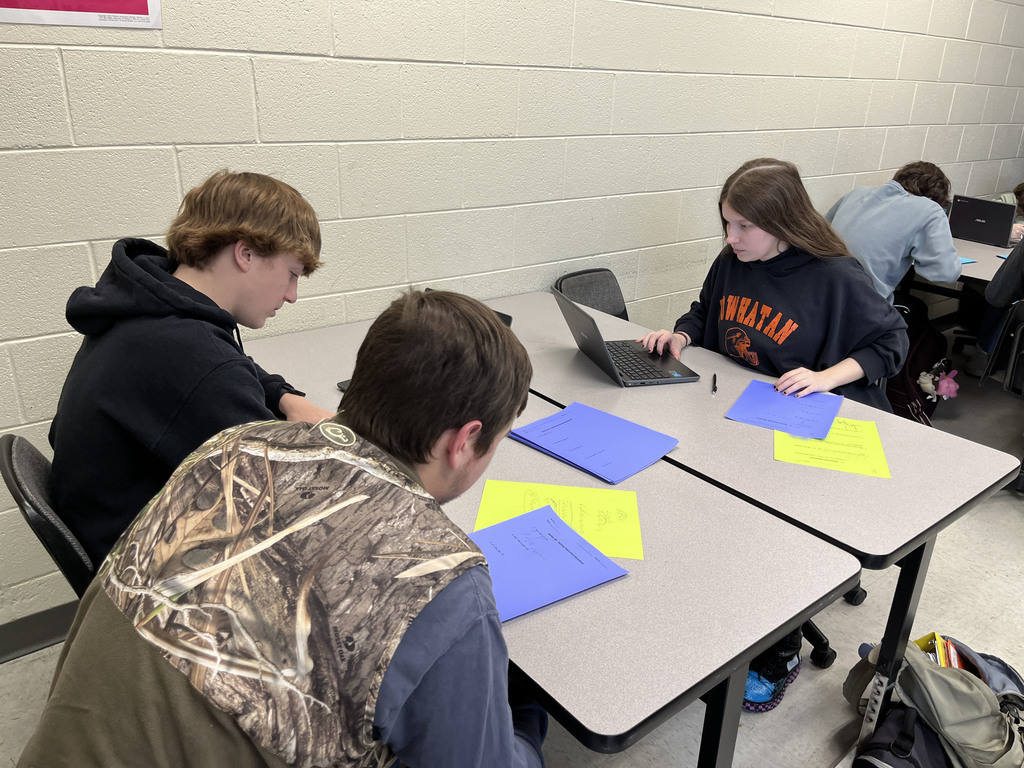 Algebra II classes work in groups to review polynomial operations and division through rotating stations