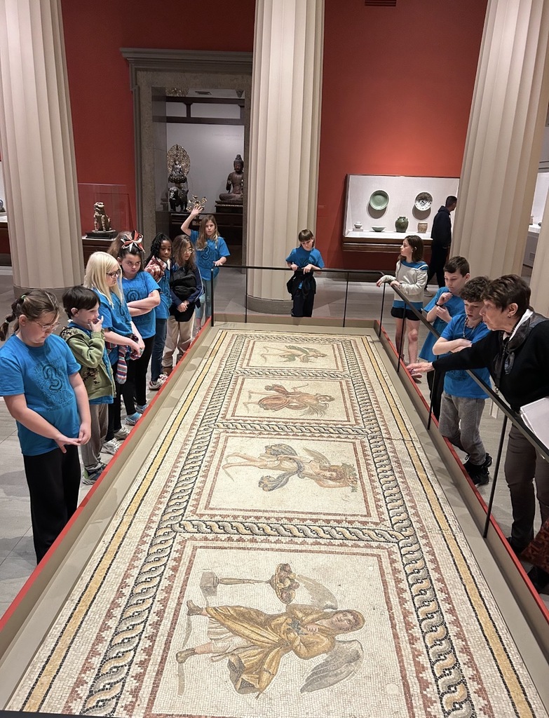 Students listen to a docent speak about artifacts at the Virginia Museum of Fine Arts