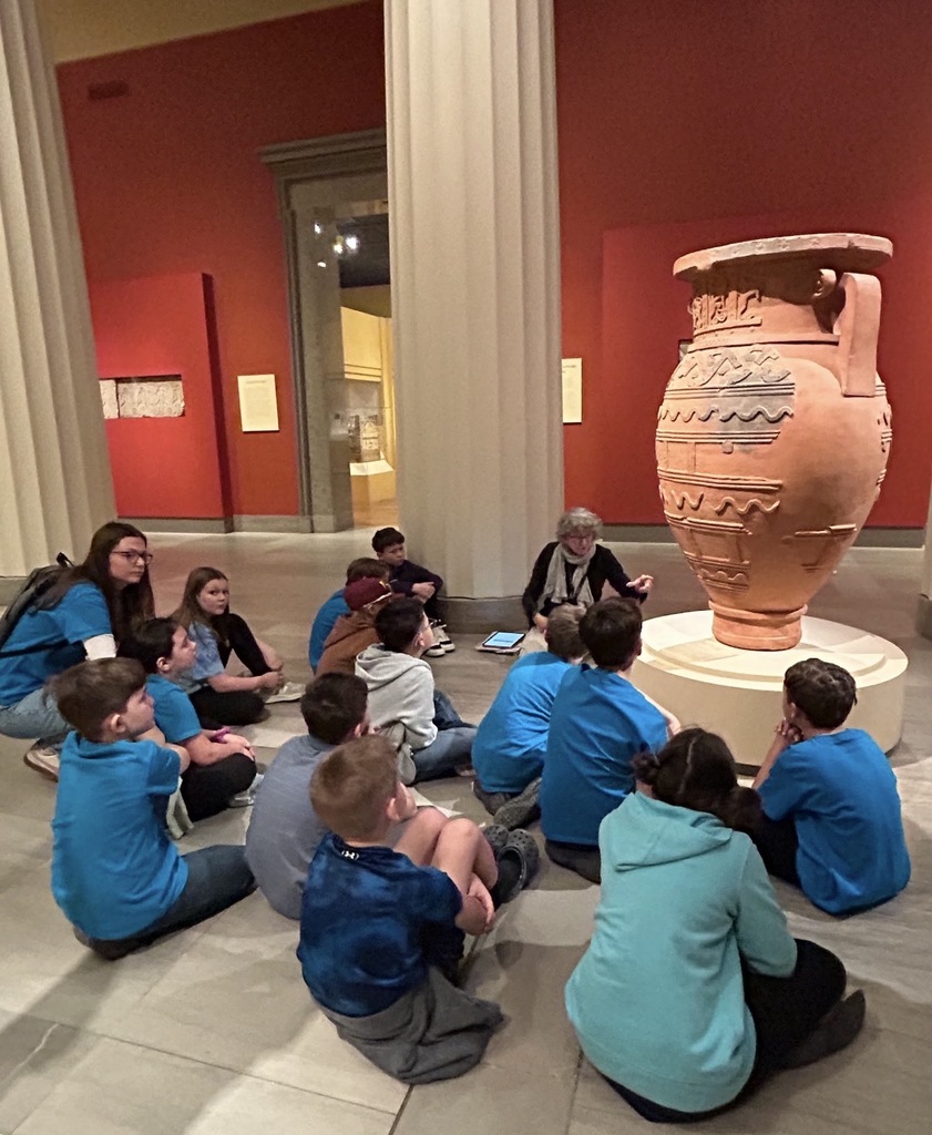 Students listen to a docent speak about artifacts at the Virginia Museum of Fine Arts